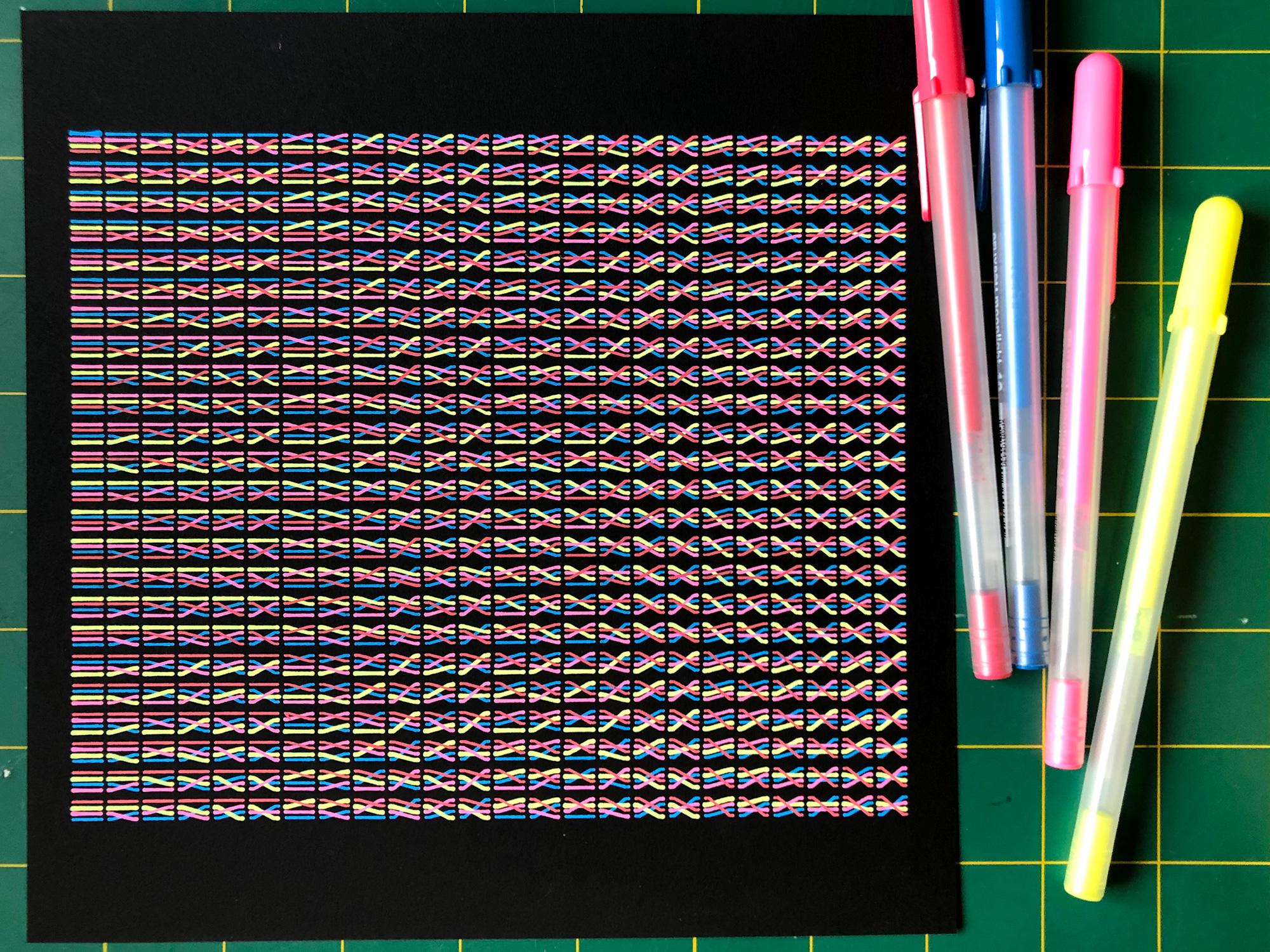 Black paper with all possible wire combinations printed, with the pens used to draw them next to the print to show scale